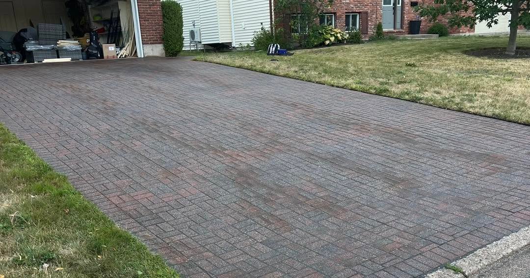 Wide driveway surfaced with brick pavers