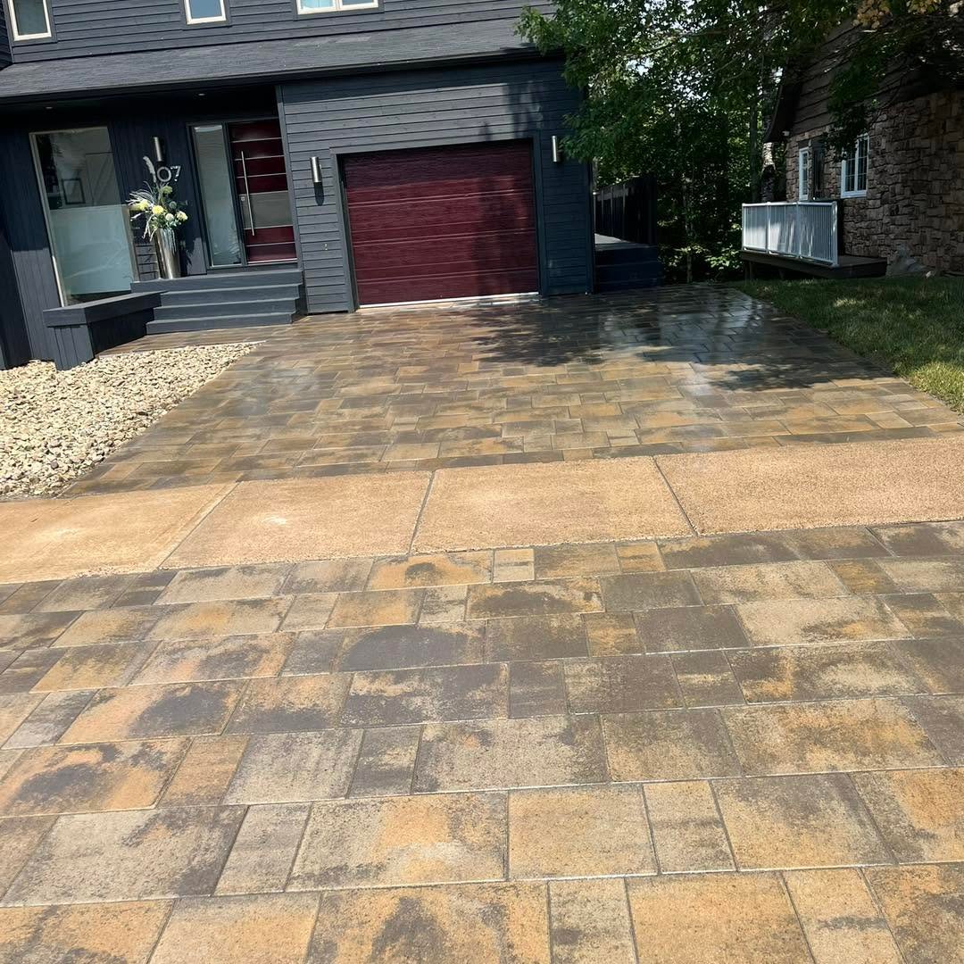 Restored paver driveway in front of a garage