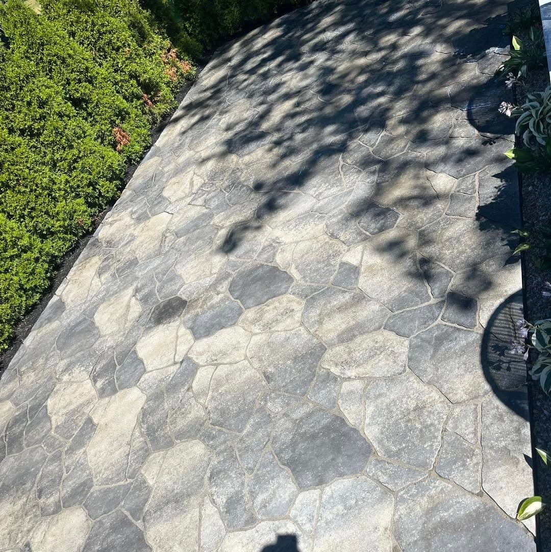 Textured grey paver patio completed by Express Landscaping